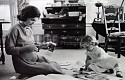 Alfred Eisenstaedt, Jacqueline Kennedy, Wife of Senator with Scissors Cutting Out Newspaper Clippings Next to Open Scrapbook as Her Young Daughter Caroline Toys with the Applicator from a Glue Bottle, At Home, Hyannis Port, MA
1960, Vintage Silver Gelatin Print