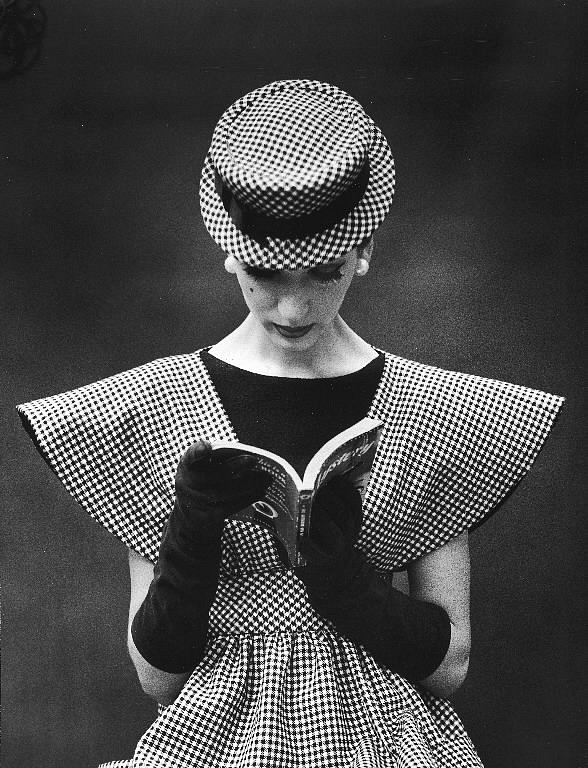 Nina Leen, Model Wearing Checked Wide Shoulder Top with Matching Hat Reading Book Looking Down, 1959
Vintage Silver Gelatin Print, 10 1/4 x 13 1/2 inches