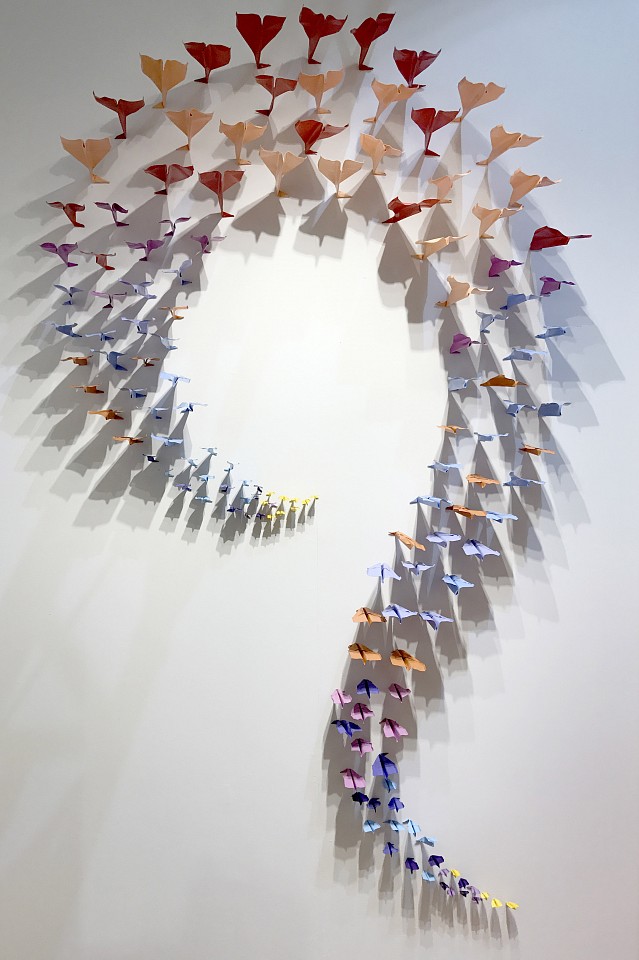 Daniele Sigalot, A fleet of planes apparently made of paper hitting the wall simultaneously in an organic shape, 2017