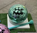 Abby Modell, Zero Gravity Golf Ball (Jade)
2026, Mirrored glass Golf ball, etched Lacquer Wood Tee
